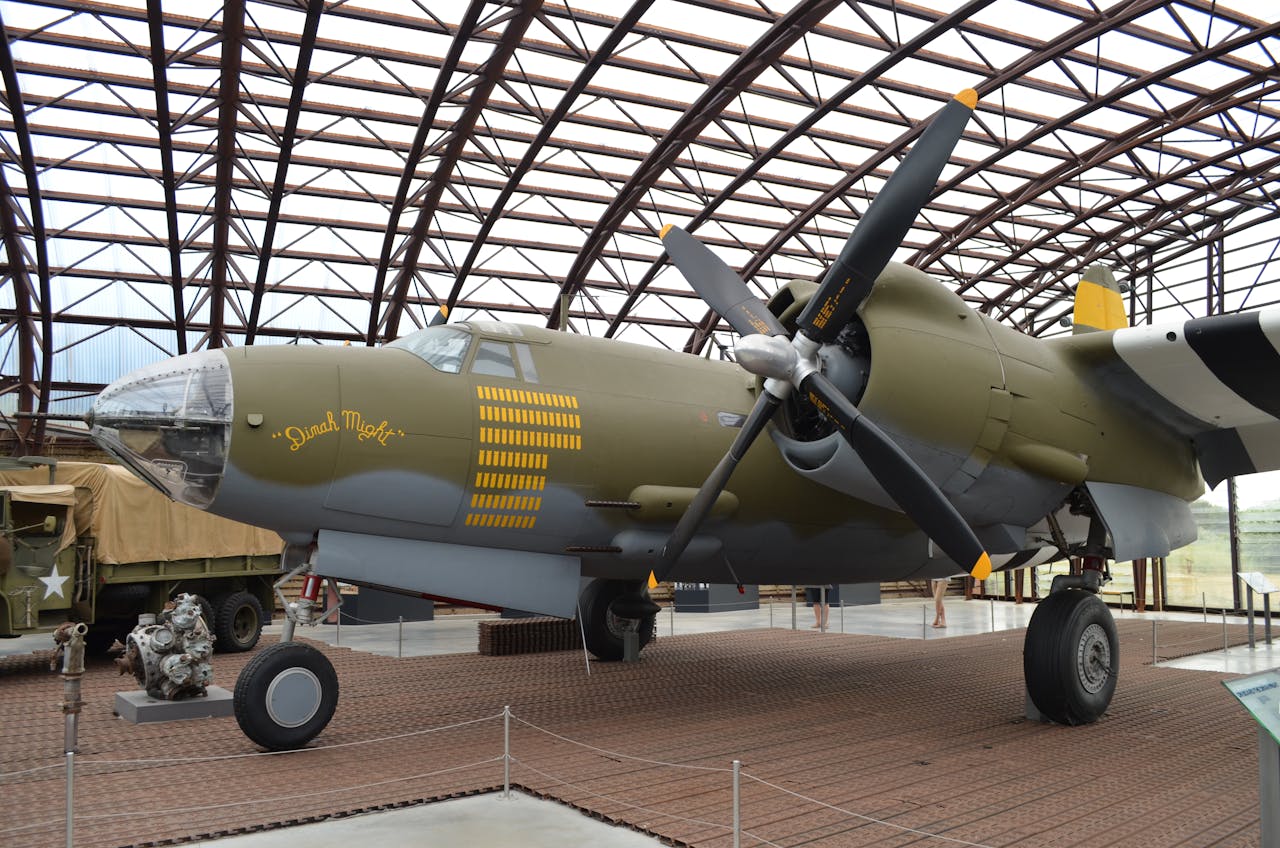 Historic B-26 bomber displayed in Normandy museum, showcasing WWII aviation history.